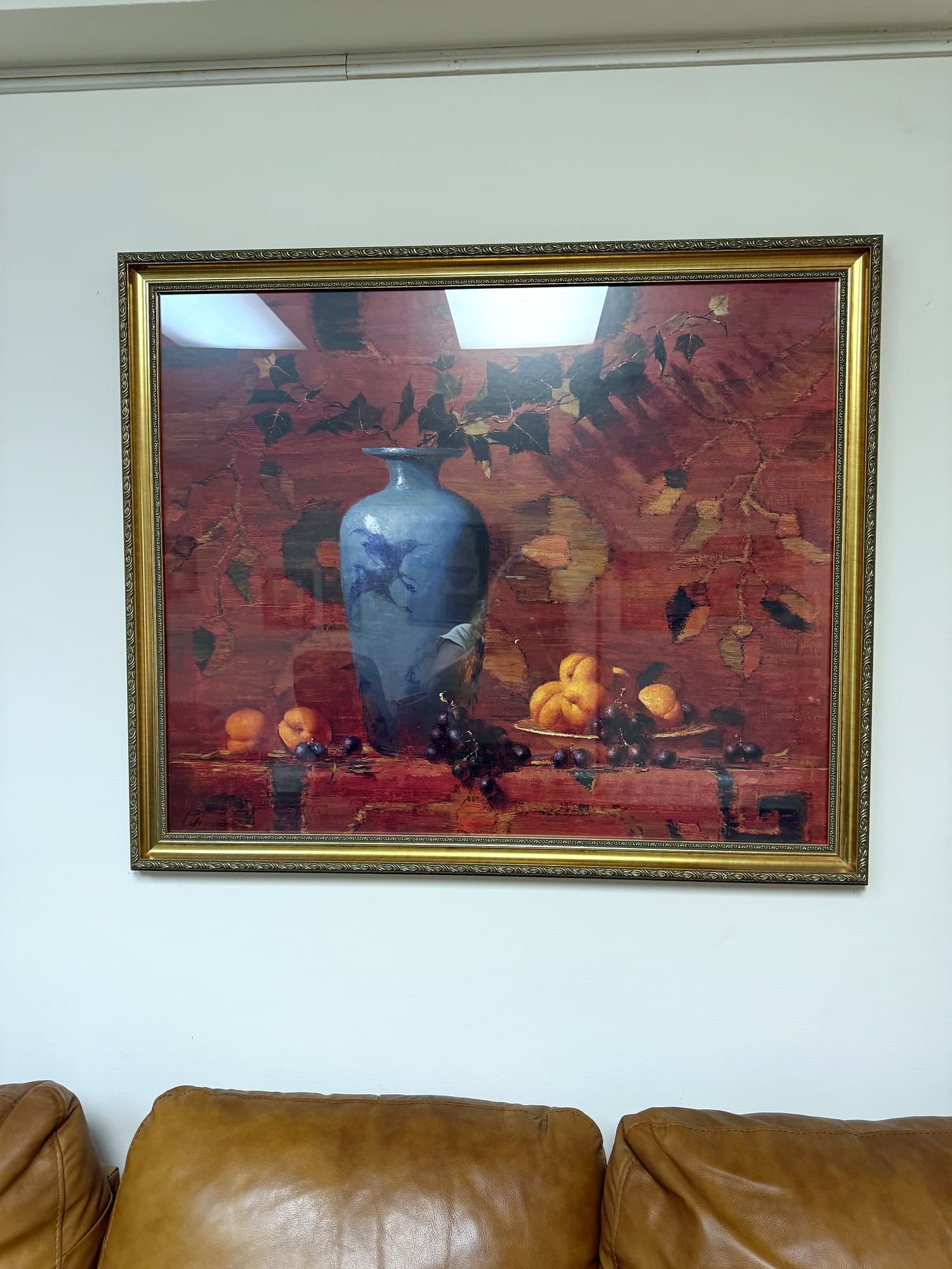 A framed still-life above the cognac sofa in Elisabeth Coffey's Florham Park office