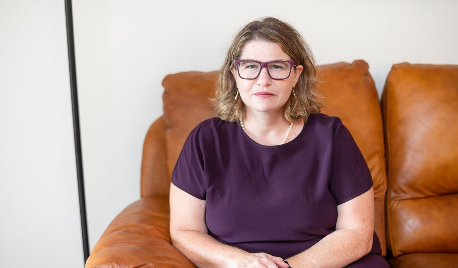 Elisabeth Coffey, LCSW · LCADC — composed portrait in her Florham Park office